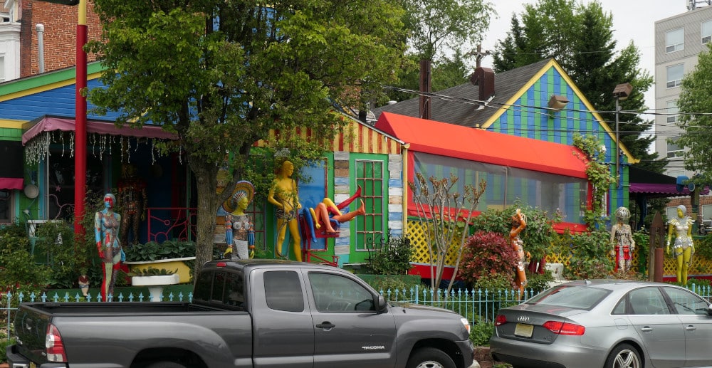 Front of colorful restaurant with multiple human figures