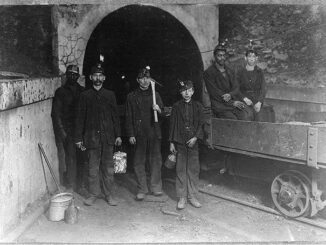 Vintage photograph of coal miners posing before starting their day in the mine.