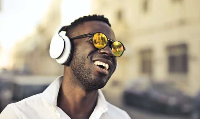 Photo of a man listening to something with headphones.