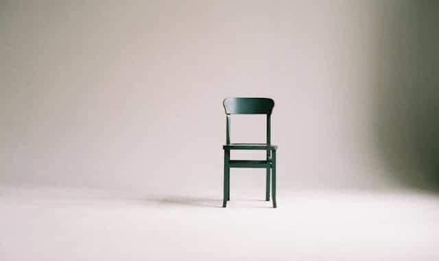 Photo of an empty chair in an empty room.