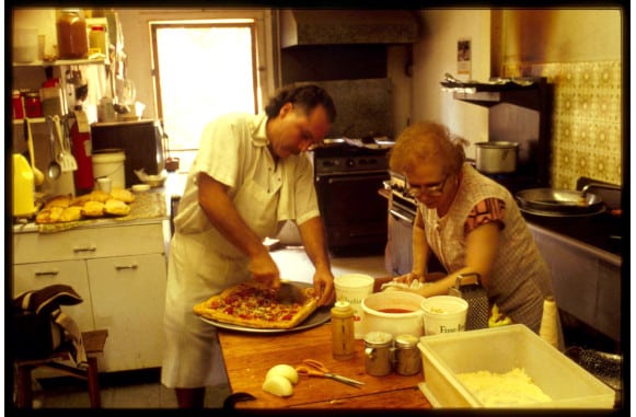 People making pizza