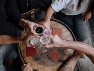 An overhead photo of pint glasses grouped together for a toast.